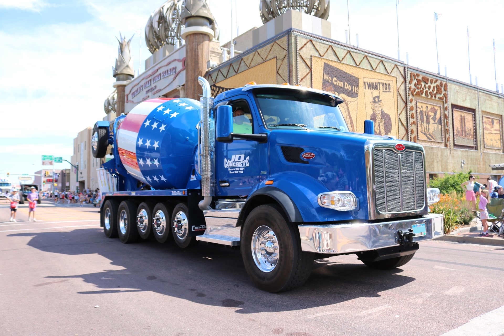 JD Concrete blue flag mixer truck in the Corn Palace parade
